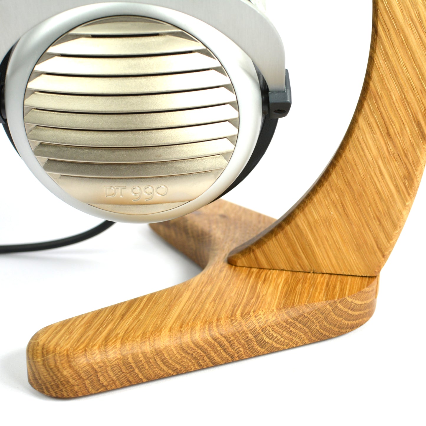 Close up of Headphones with wooden stand on a white background