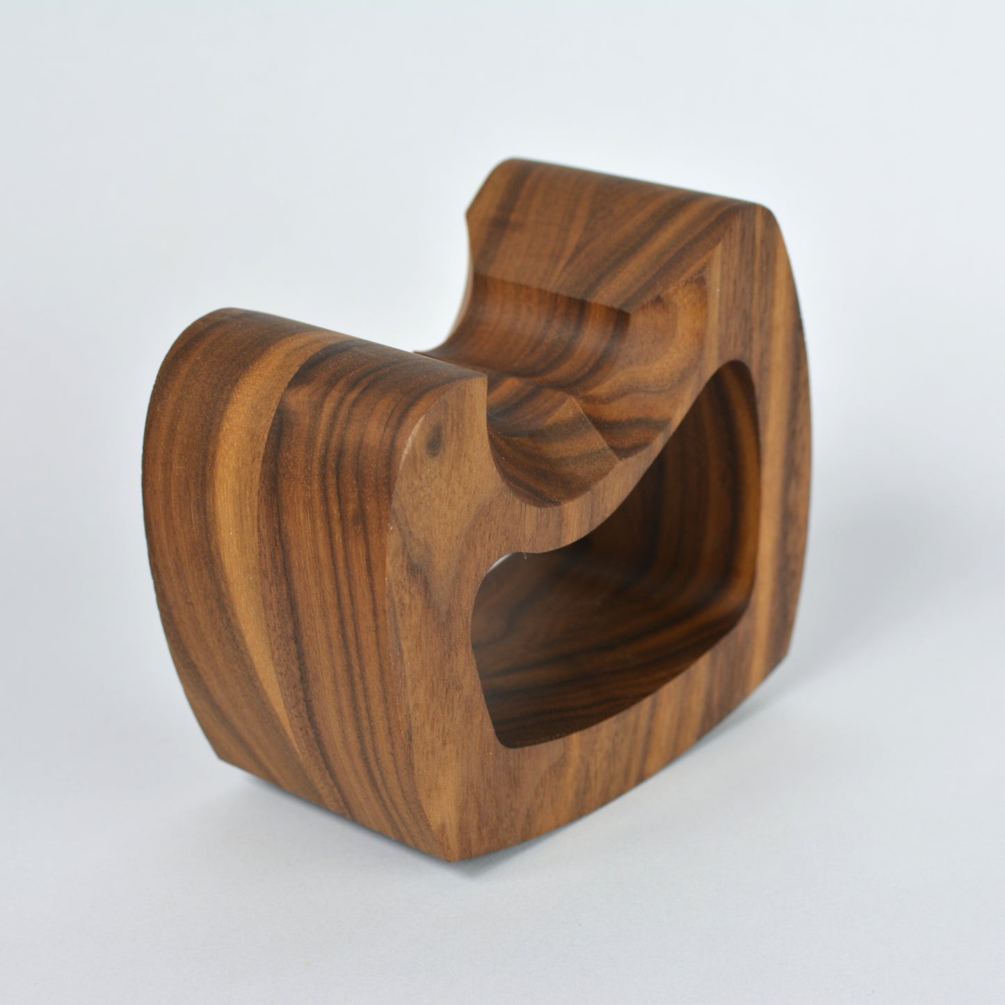 Wooden controller stand with a unique design on a white background