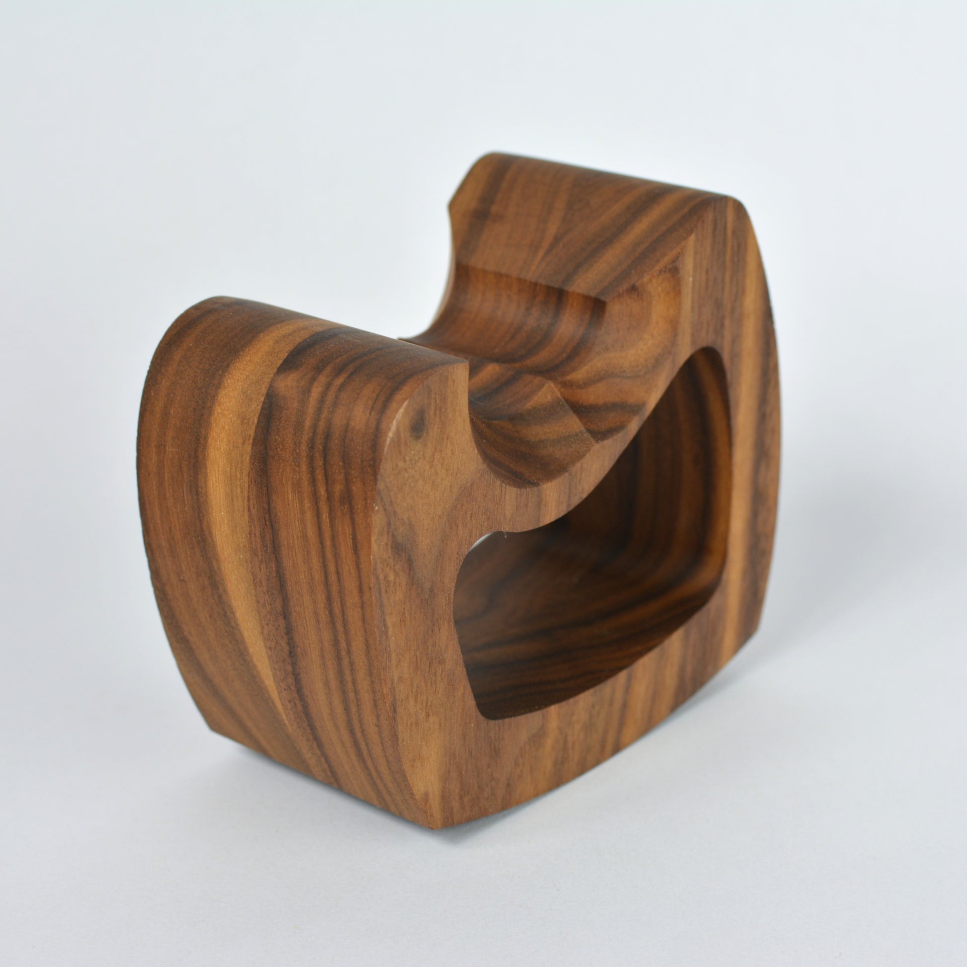 Wooden controller stand with a unique design on a white background