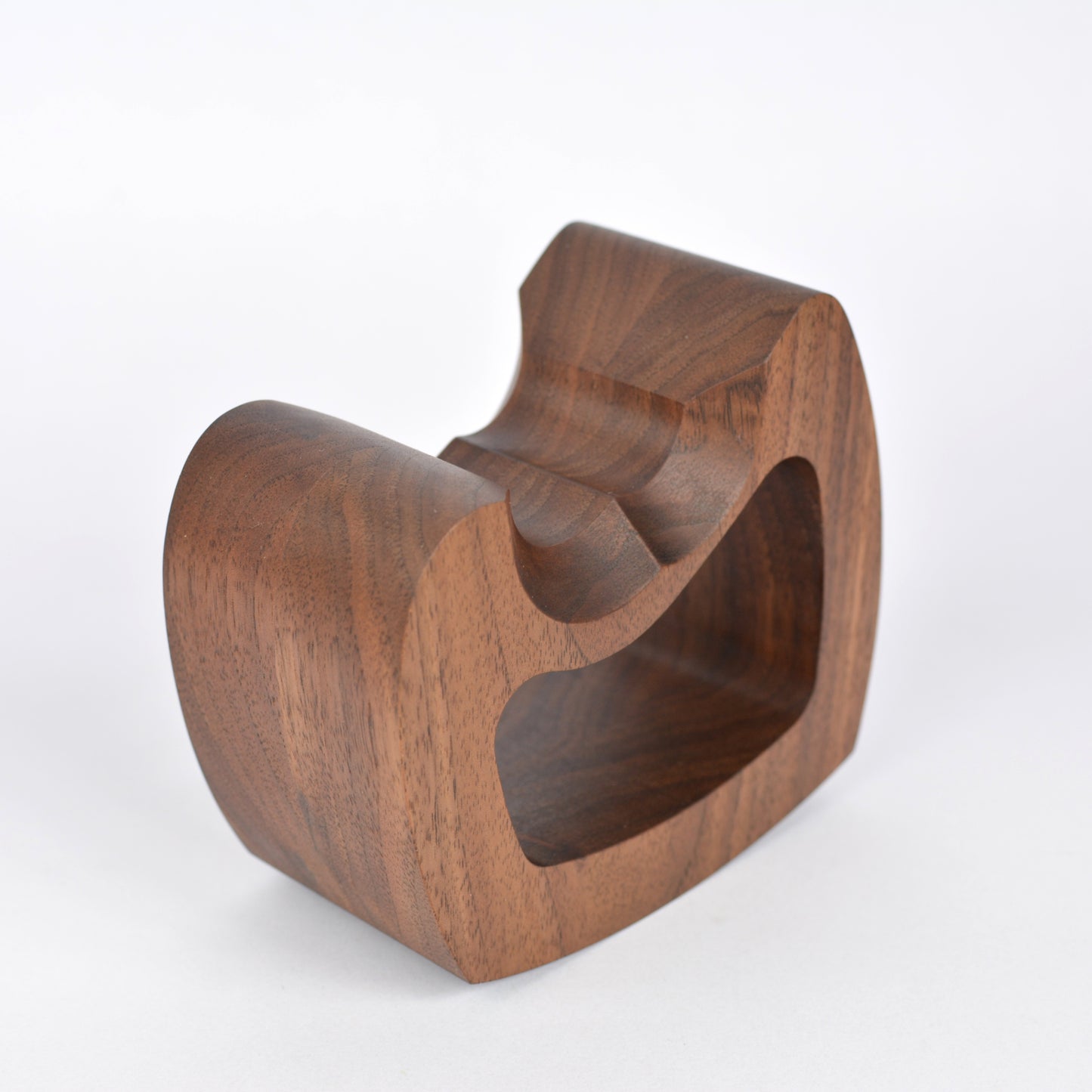 Wooden PS5 controller stand on white background