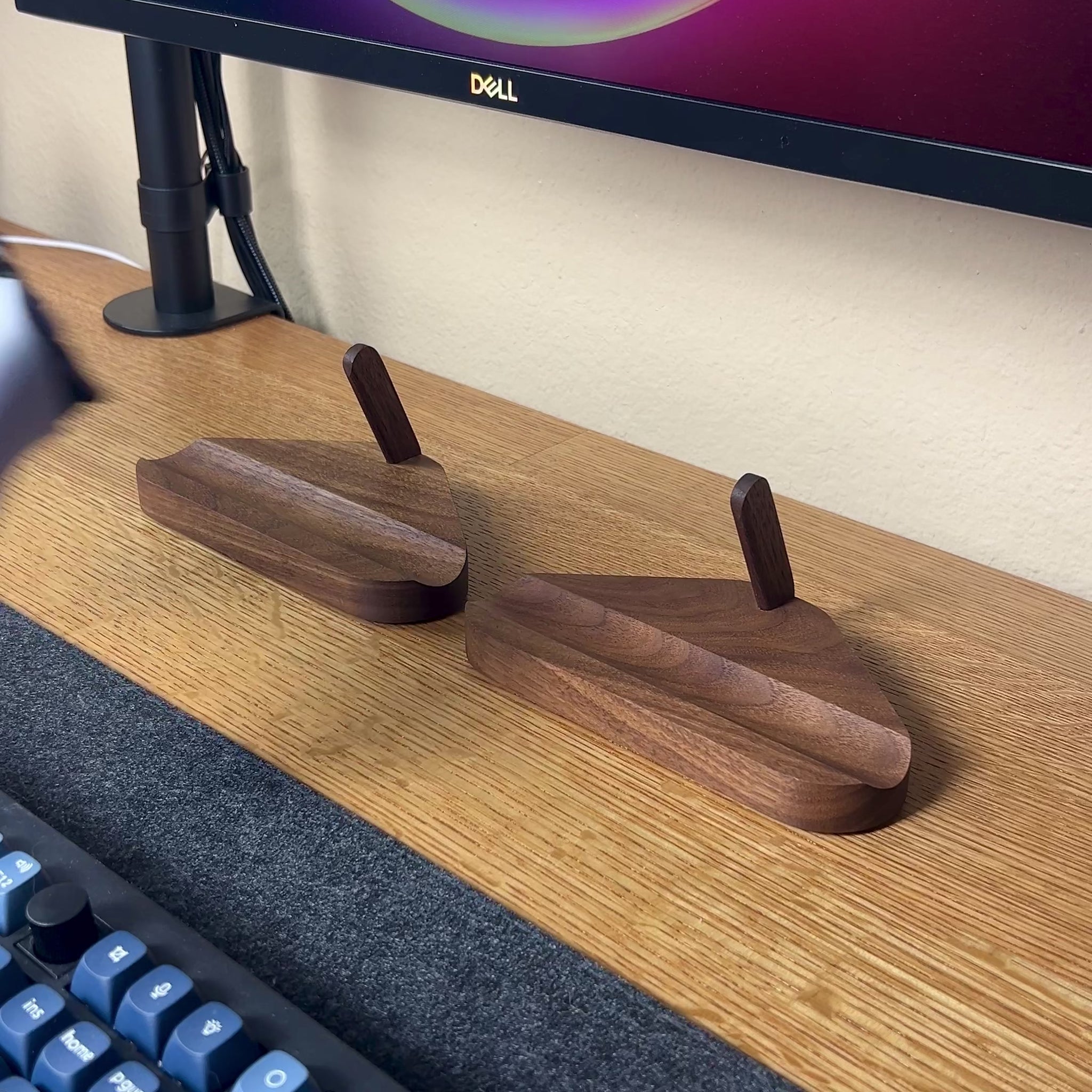 demonstration of game controller stands using an xbox and ps5 controller